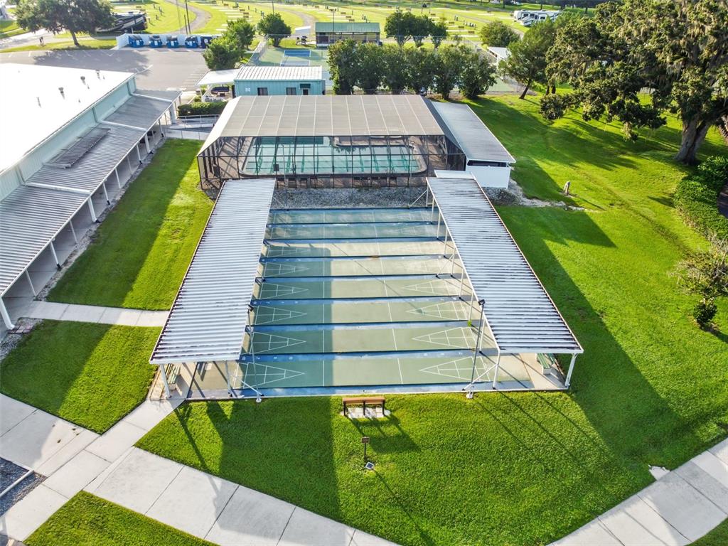 29129 Johnston Road, Unit 2626 Dade City, FL 33523 - Photo 30 of 31 a view of swimming pool with a garden and couches