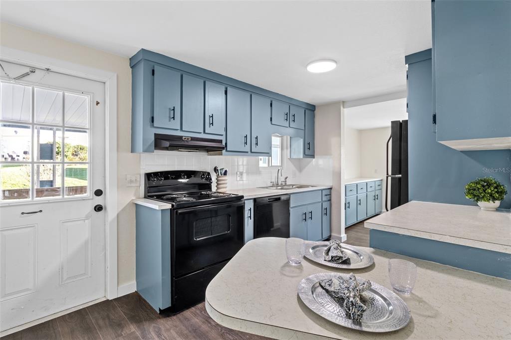 29129 Johnston Road, Unit 2626 Dade City, FL 33523 - Photo 3 of 31 a kitchen with stainless steel appliances granite countertop a sink stove and refrigerator