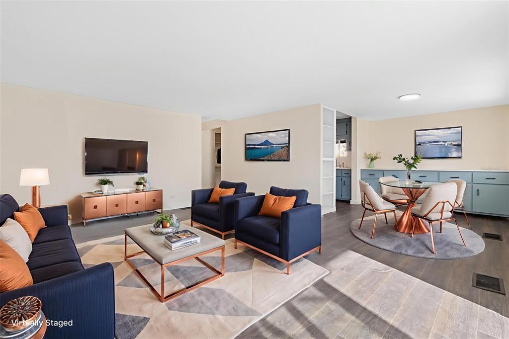 29129 Johnston Road, Unit 2626 Dade City, FL 33523 - Photo 6 of 31 a living room with furniture and a flat screen tv