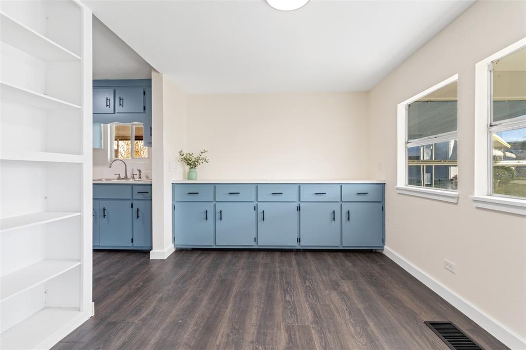 29129 Johnston Road, Unit 2626 Dade City, FL 33523 - Photo 6 of 31 a view of cabinets and wooden floor