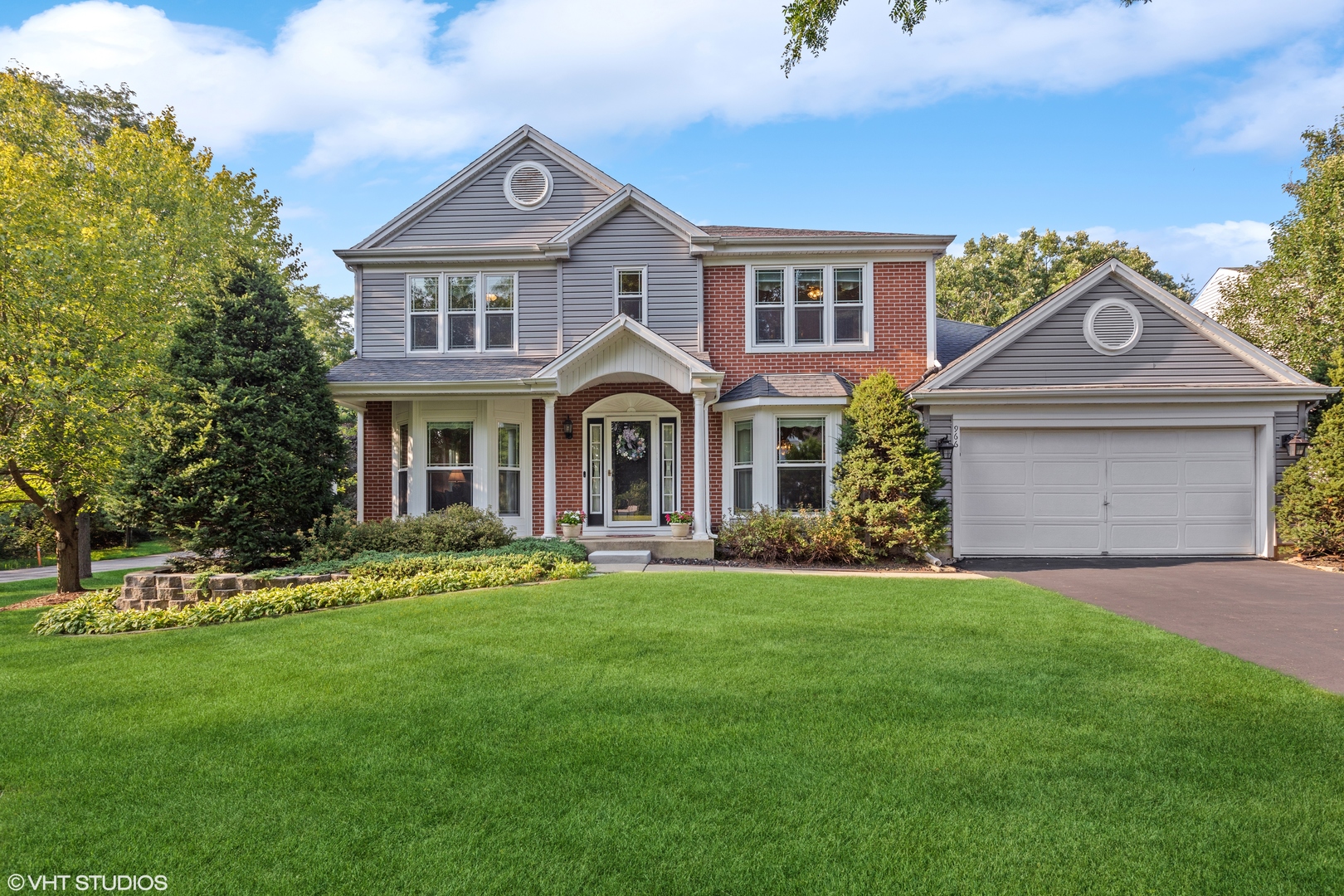 966 Ridgewood Drive Cary, IL 60013 - Photo 31 of 31 a front view of a house with a yard