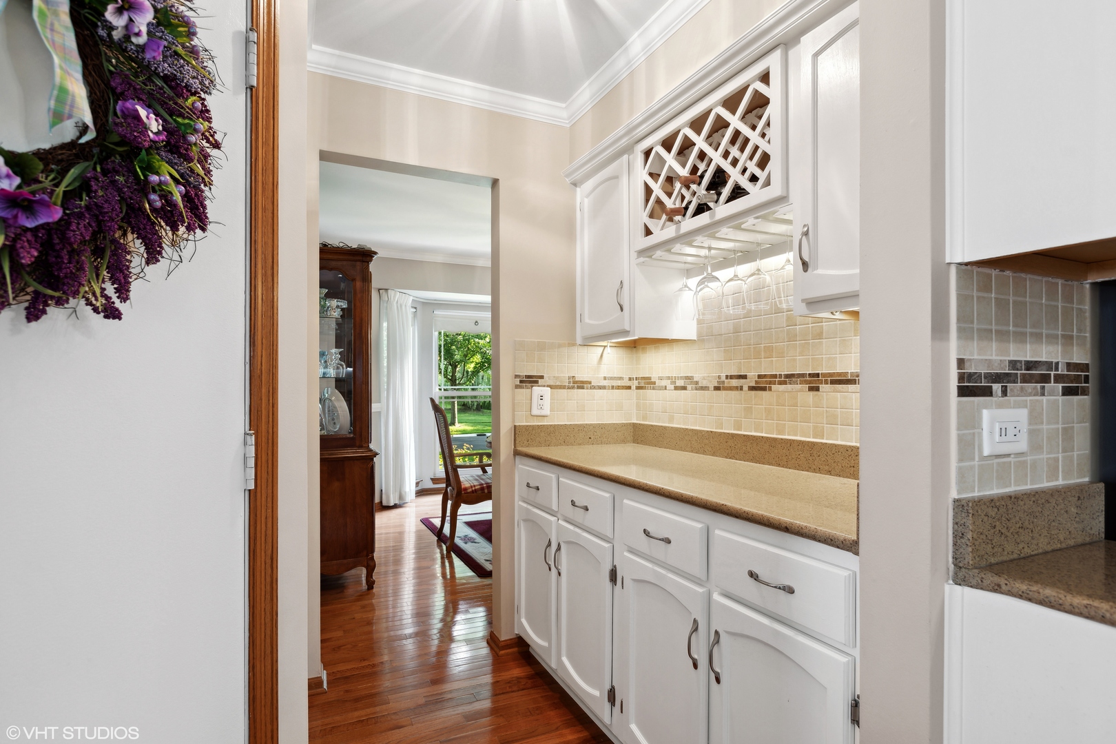966 Ridgewood Drive Cary, IL 60013 - Photo 6 of 31 a view of a kitchen from the hallway with wooden floor