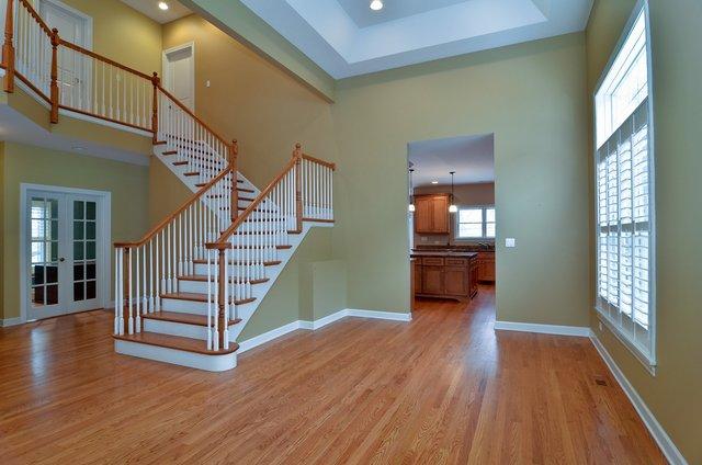 339 Ridge Road Highland Park, IL 60035 - Photo 3 of 9 a view of a hallway with stairs and wooden floor