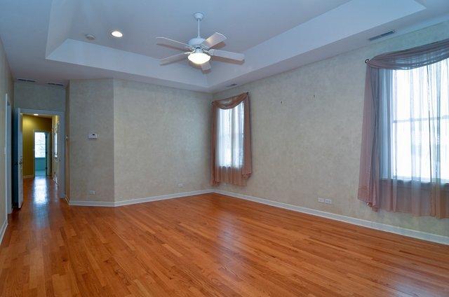 339 Ridge Road Highland Park, IL 60035 - Photo 6 of 9 a view of an empty room with wooden floor and a window