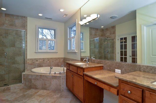 339 Ridge Road Highland Park, IL 60035 - Photo 7 of 9 a spacious bathroom with a granite countertop sink a bathtub and a shower