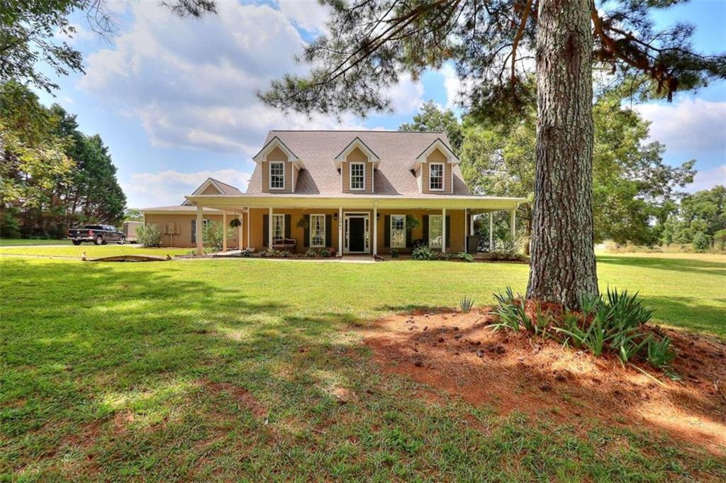 3061 Mount Paran Church Road Monroe, GA 30655 - Photo 1 of 1 a view of house with outdoor space and garden