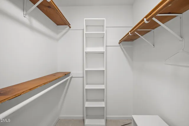 a view of an empty walk in closet