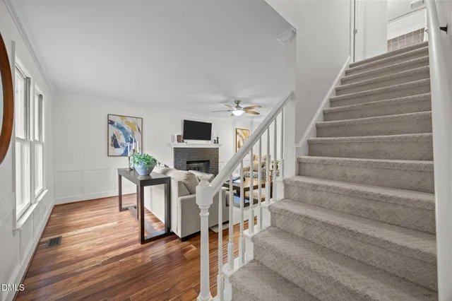 a view of entryway and hall with wooden floor