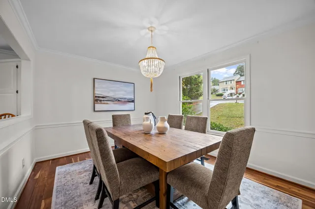 a view of a city with lush green forest