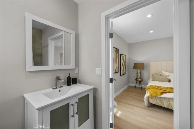a en suite bathroom with a sink and mirror