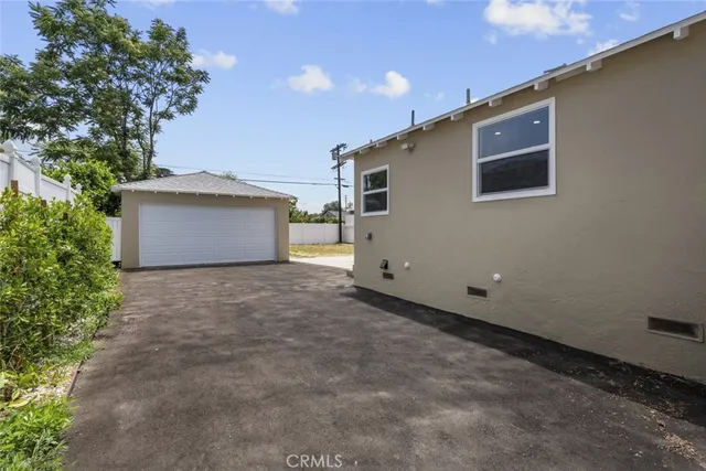 a backyard of a house with a yard and garage