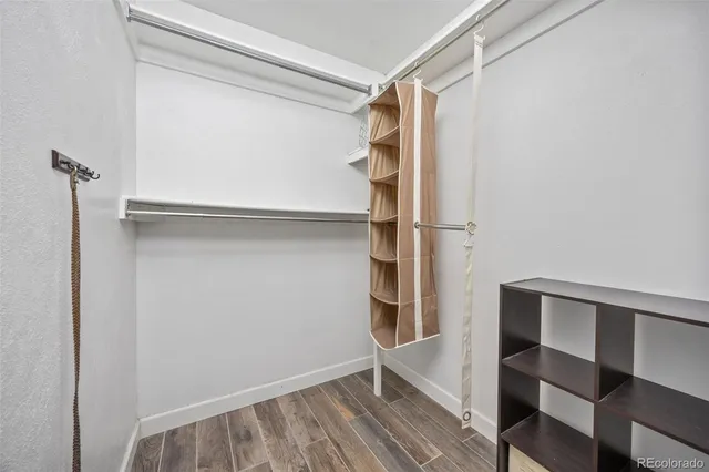 a view of walk in closet with empty racks