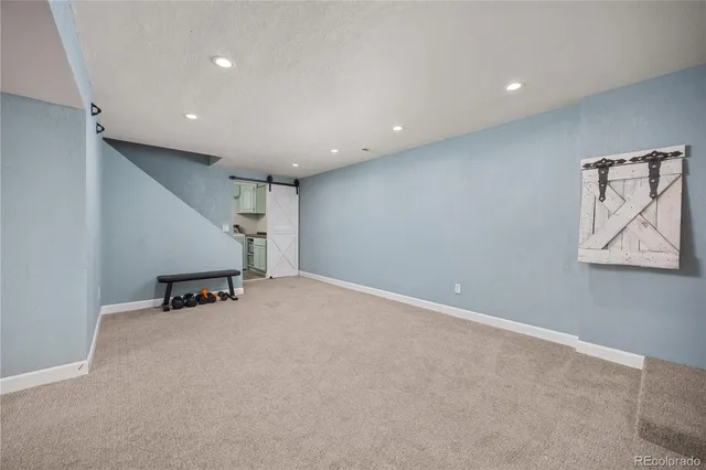 an empty room with closet and cabinet