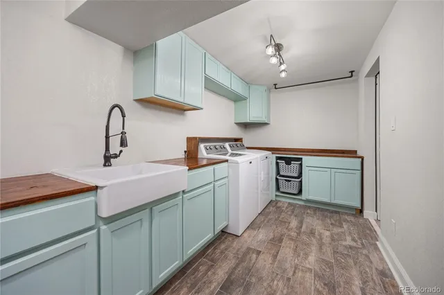 a kitchen with a sink cabinets and appliances
