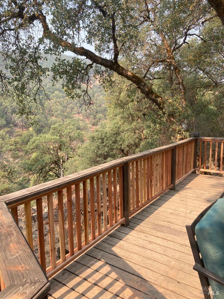 35000 Mendocino Pass Road Covelo, CA 95428 - Photo 14 of 26 a balcony with wooden floor and fence