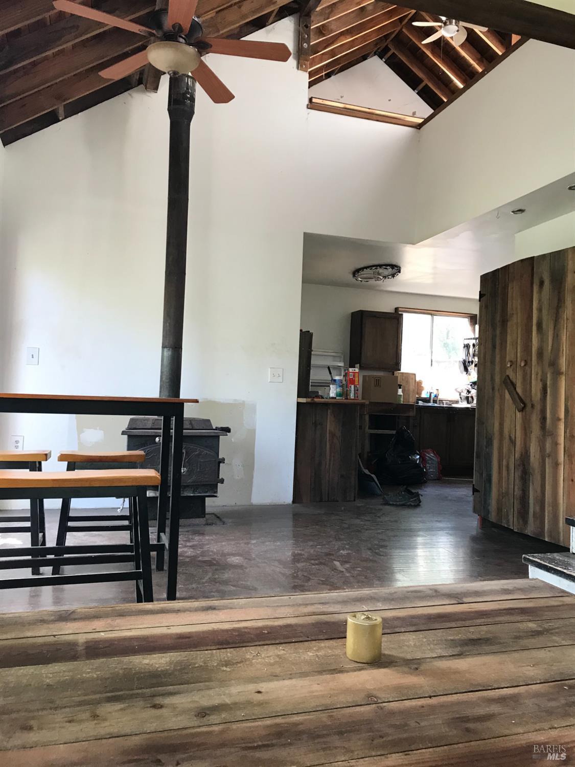 35000 Mendocino Pass Road Covelo, CA 95428 - Photo 6 of 26 a view of living room with furniture and a ceiling fan