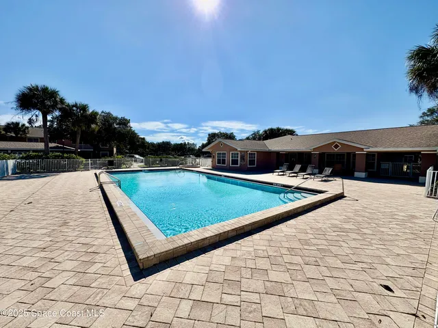 a view of swimming pool with lounge chair