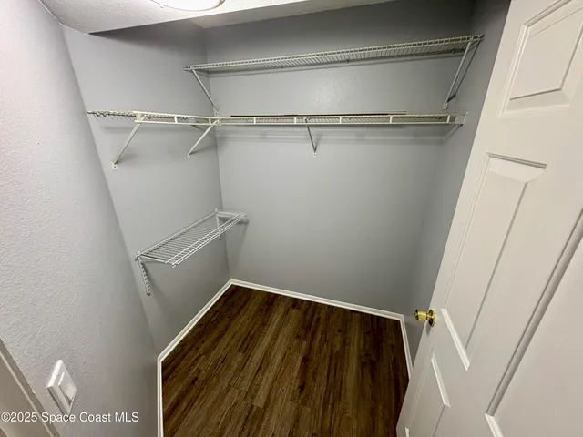 a view of a room with racks on the wall