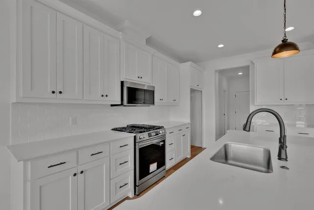 a kitchen with sink and refrigerator