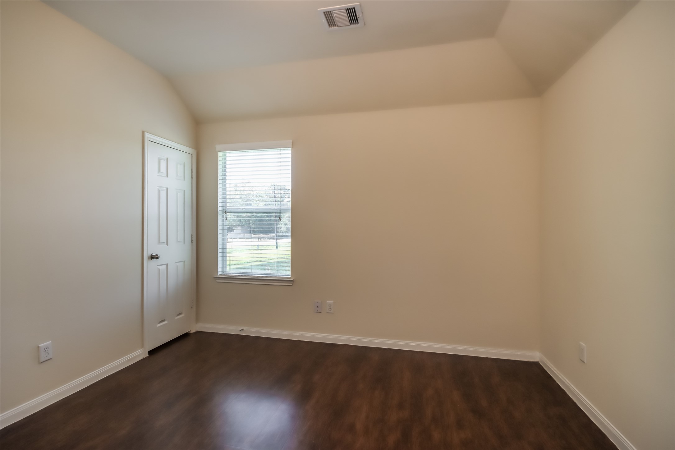 13022 Ristina Circle Houston, TX 77048 - Photo 13 of 15 an empty room with wooden floor and window