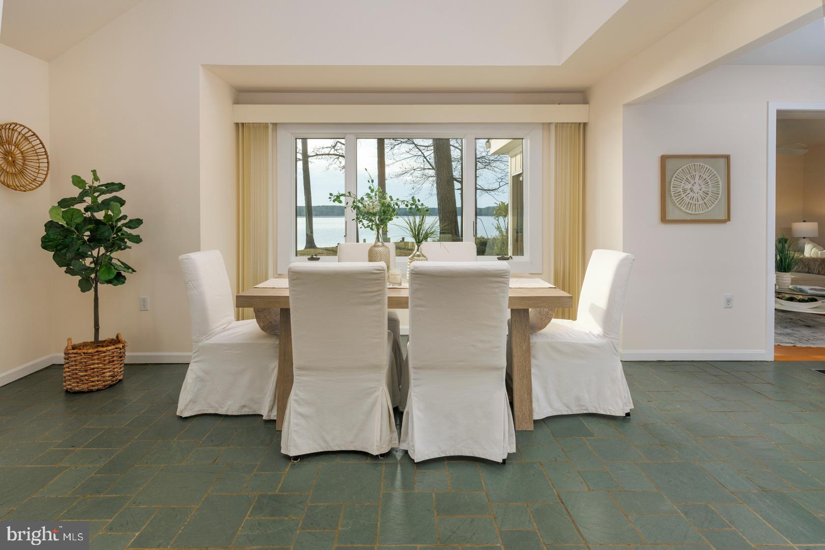 7930 Church Neck Road St. Michaels, MD 21663 - Photo 12 of 41 a living room with furniture and a potted plant