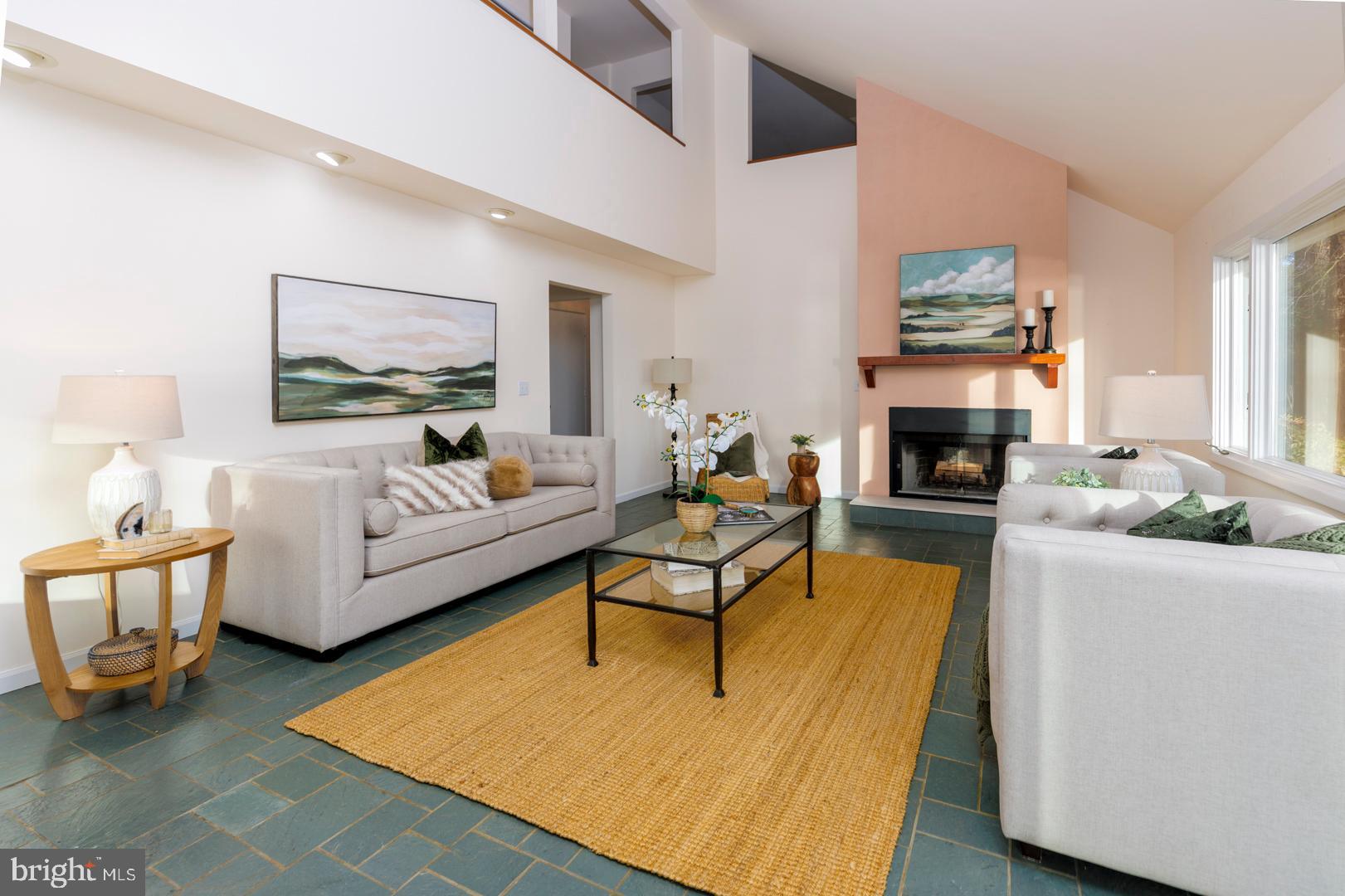 7930 Church Neck Road St. Michaels, MD 21663 - Photo 13 of 41 a living room with furniture and a fireplace