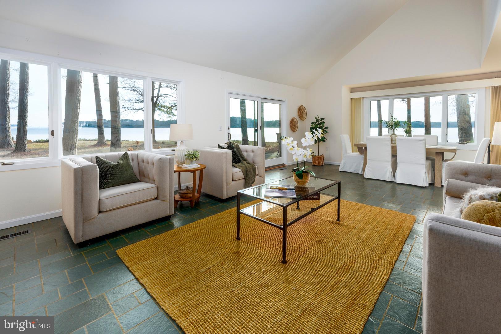 7930 Church Neck Road St. Michaels, MD 21663 - Photo 15 of 41 a living room with furniture and a table