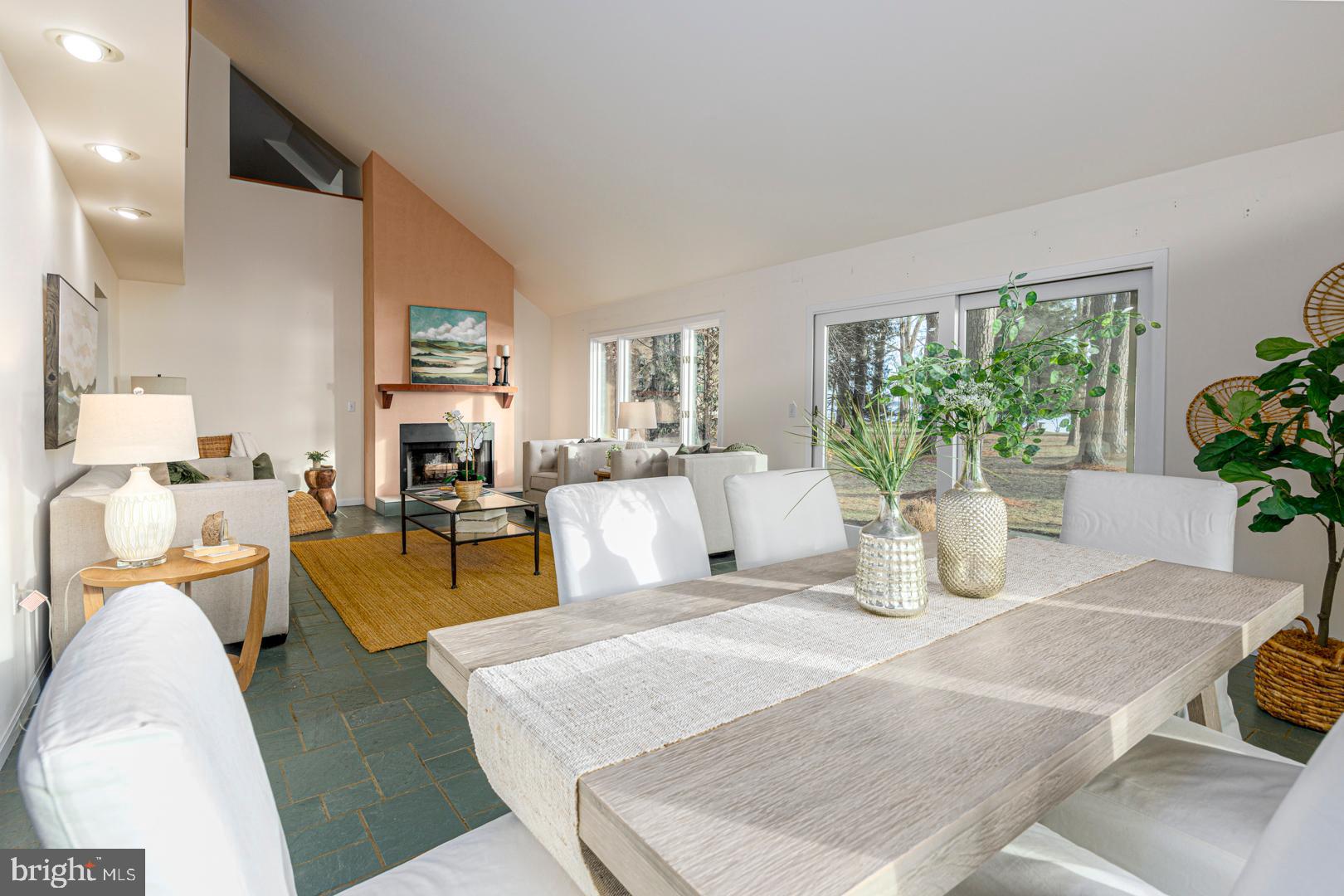 7930 Church Neck Road St. Michaels, MD 21663 - Photo 17 of 41 a living room with furniture potted plant and a window
