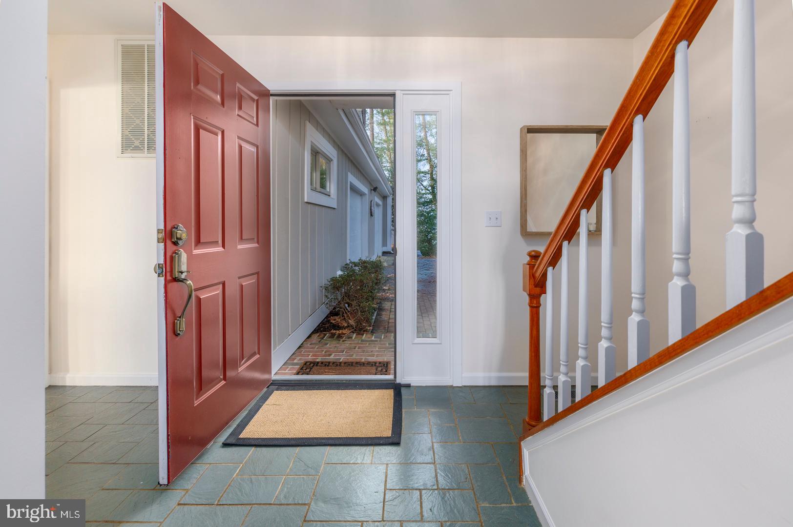 7930 Church Neck Road St. Michaels, MD 21663 - Photo 19 of 41 a view of a hallway with wooden floor and staircase