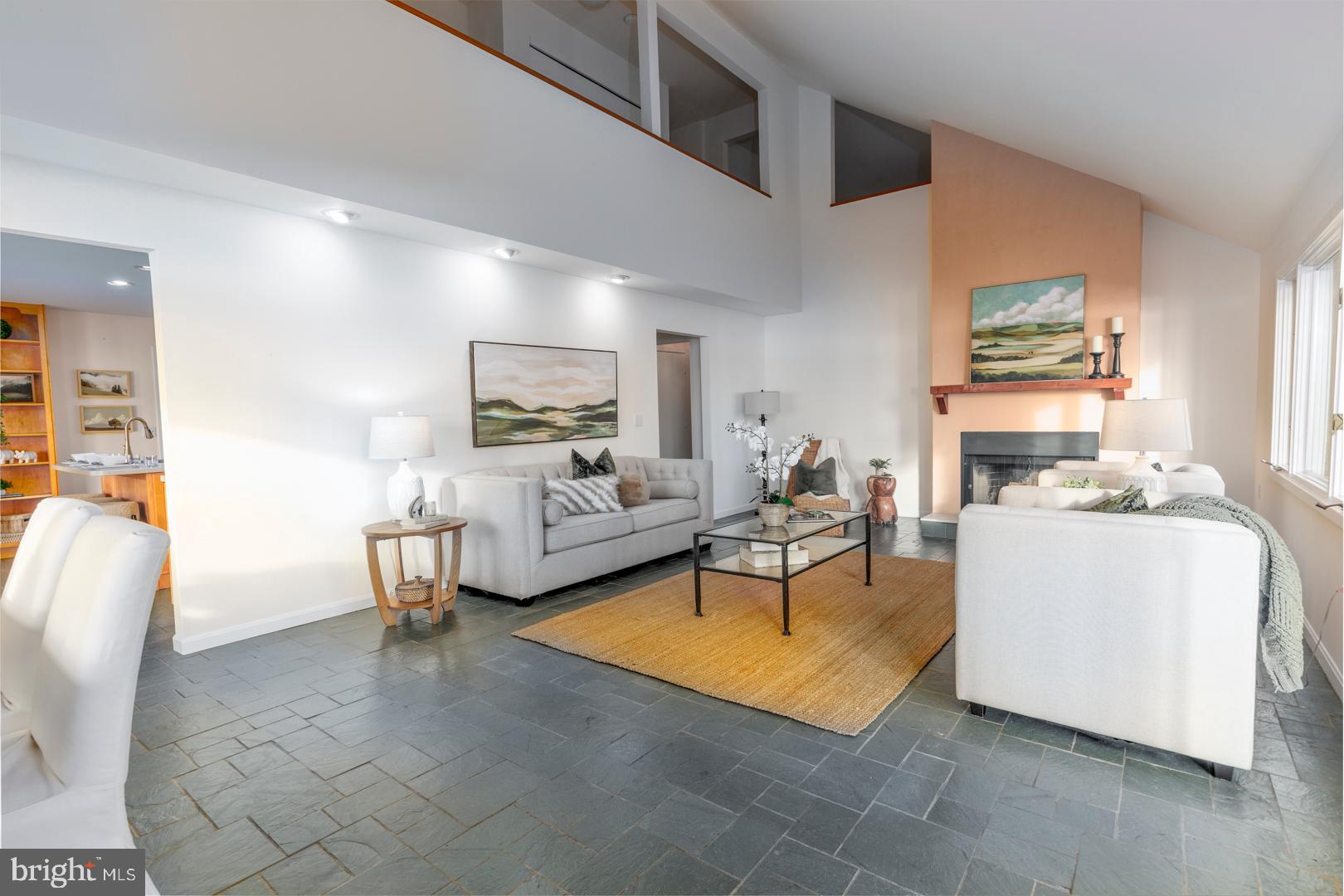 7930 Church Neck Road St. Michaels, MD 21663 - Photo 20 of 41 a living room with furniture and a fireplace