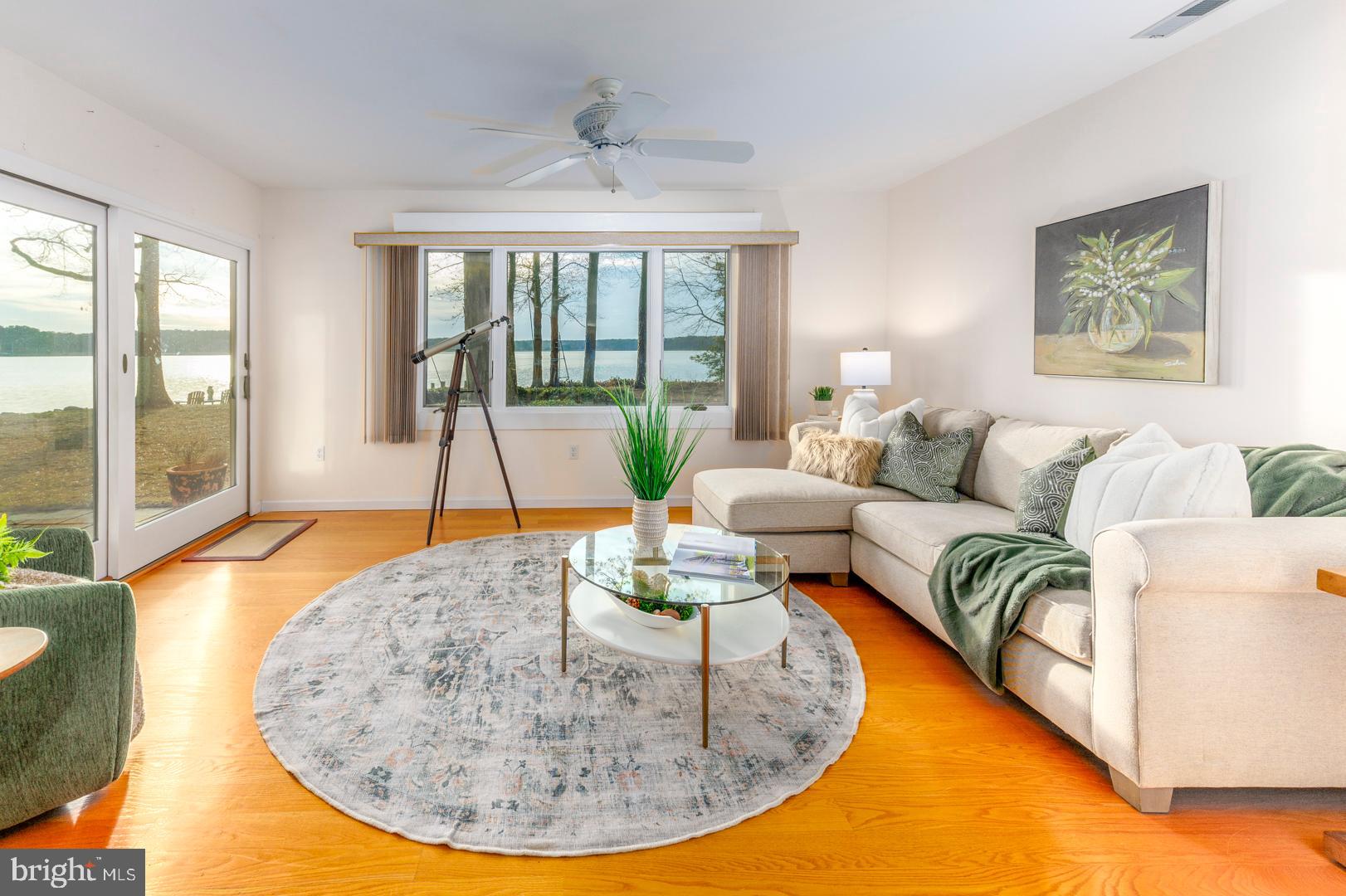7930 Church Neck Road St. Michaels, MD 21663 - Photo 28 of 41 a living room with furniture and a large window