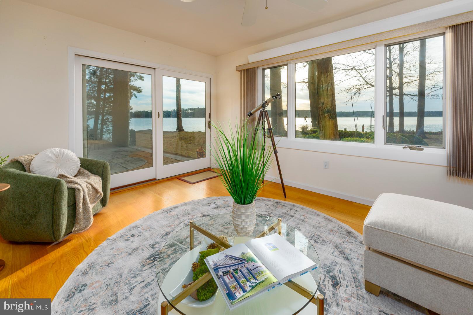 7930 Church Neck Road St. Michaels, MD 21663 - Photo 29 of 41 a living room with furniture and a large window