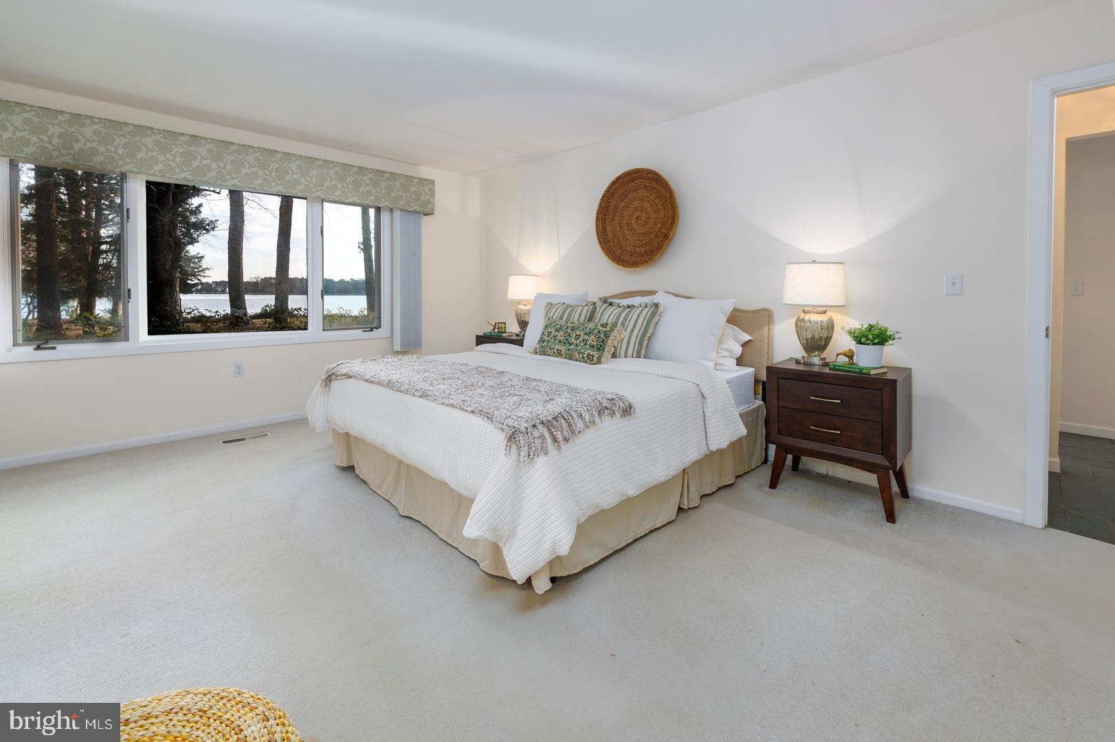 7930 Church Neck Road St. Michaels, MD 21663 - Photo 30 of 41 a bedroom with a bed and window