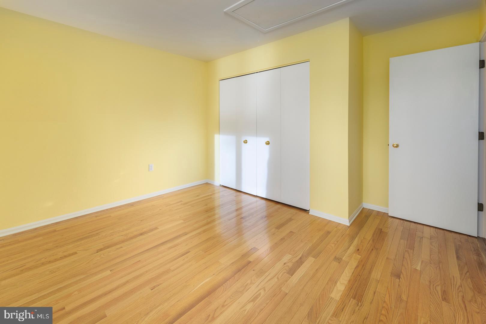 7930 Church Neck Road St. Michaels, MD 21663 - Photo 34 of 41 a view of an empty room with wooden floor and a window