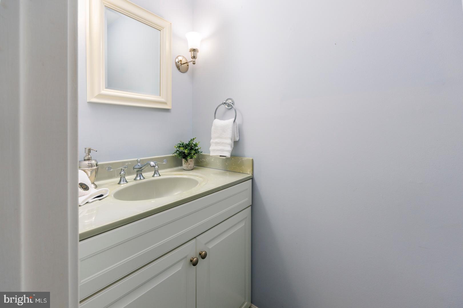 7930 Church Neck Road St. Michaels, MD 21663 - Photo 37 of 41 a bathroom with a sink and a mirror