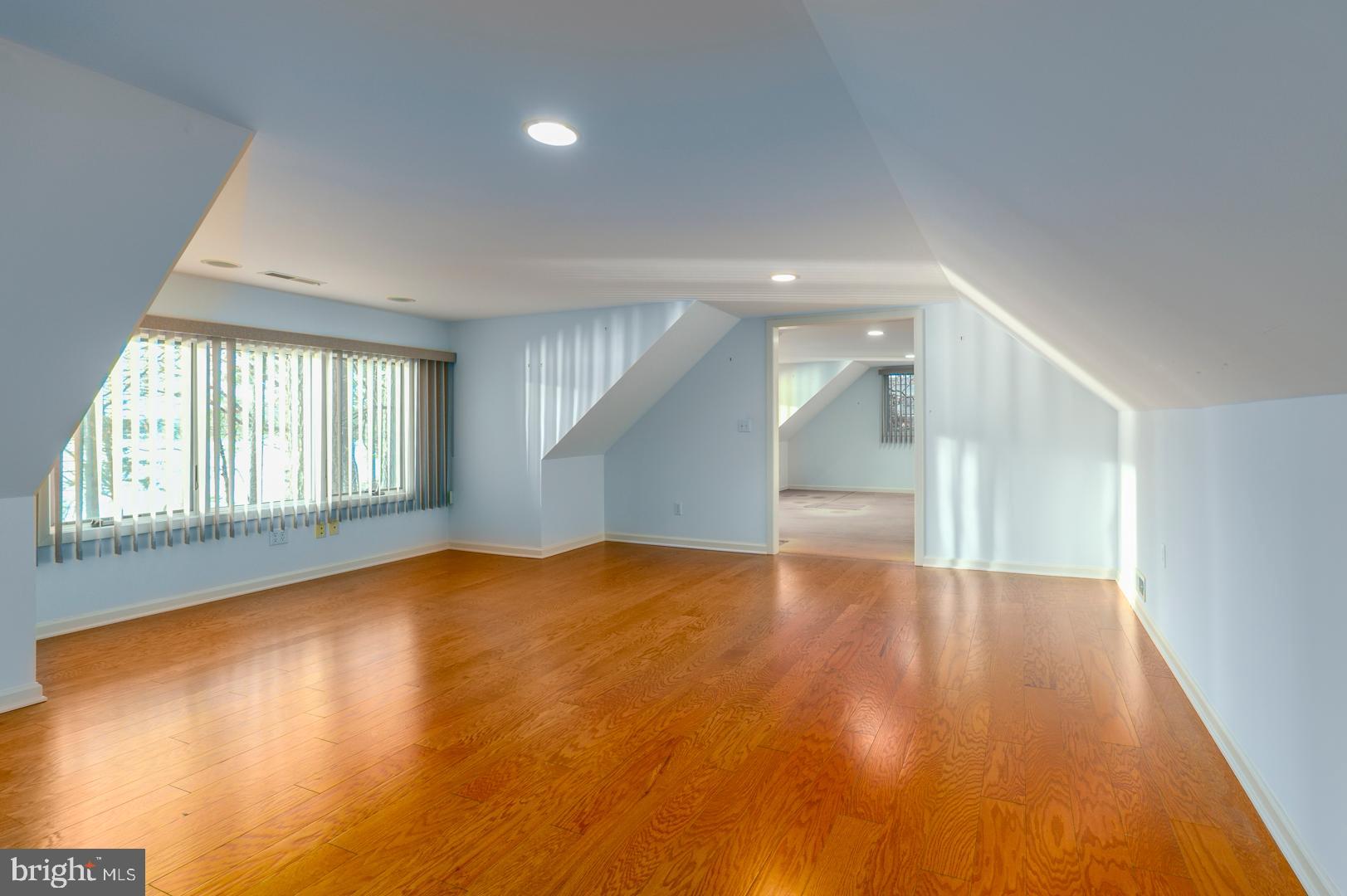 7930 Church Neck Road St. Michaels, MD 21663 - Photo 40 of 41 an empty room with wooden floor and windows