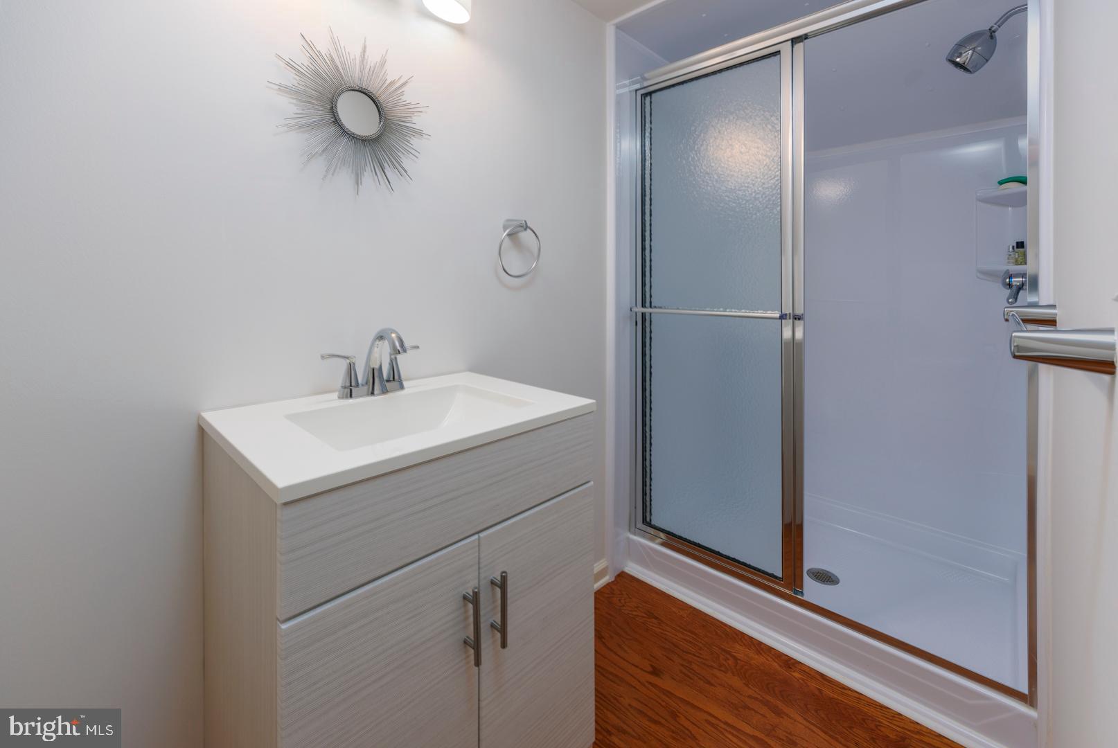 7930 Church Neck Road St. Michaels, MD 21663 - Photo 41 of 41 a bathroom with a sink and a mirror