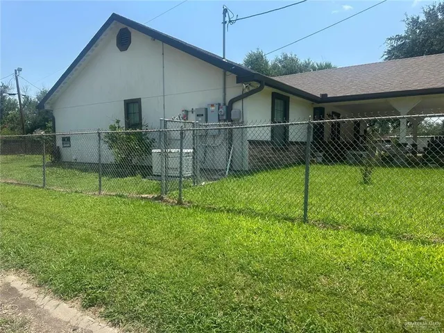 a house with trees in the background