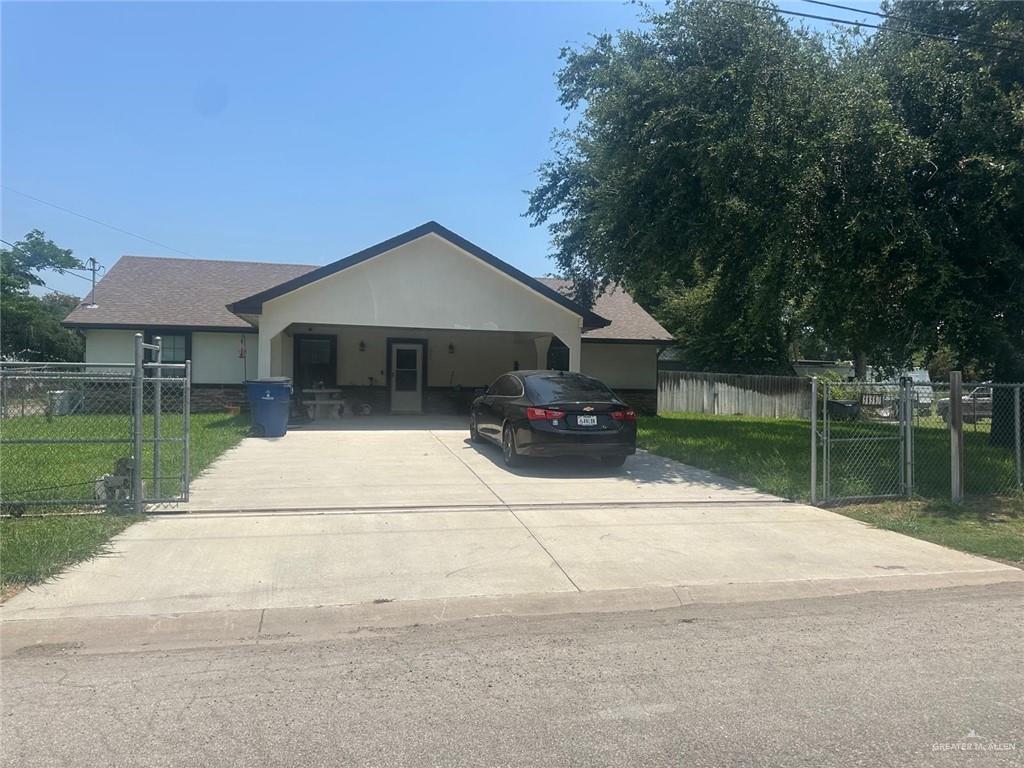 330 West Adams Street Falfurrias, TX 78355 - Photo 3 of 14 a house with river in front of it
