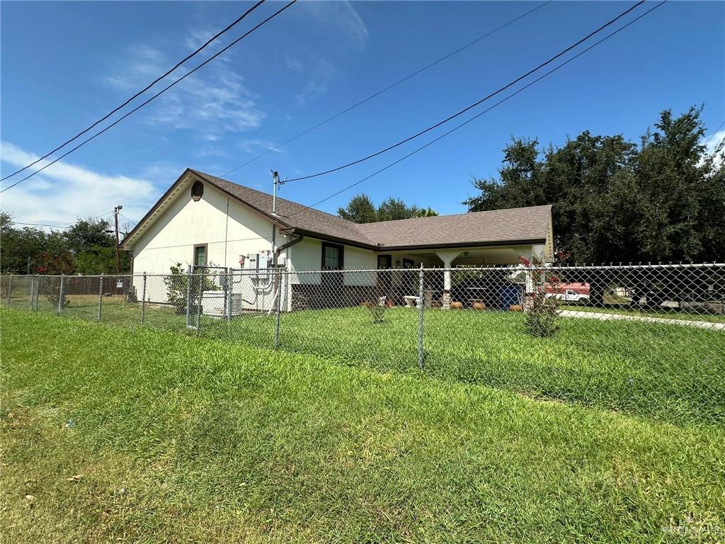 330 West Adams Street Falfurrias, TX 78355 - Photo 5 of 14 a view of house with backyard and entertaining space