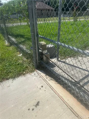 a view of a yard with street from a chair