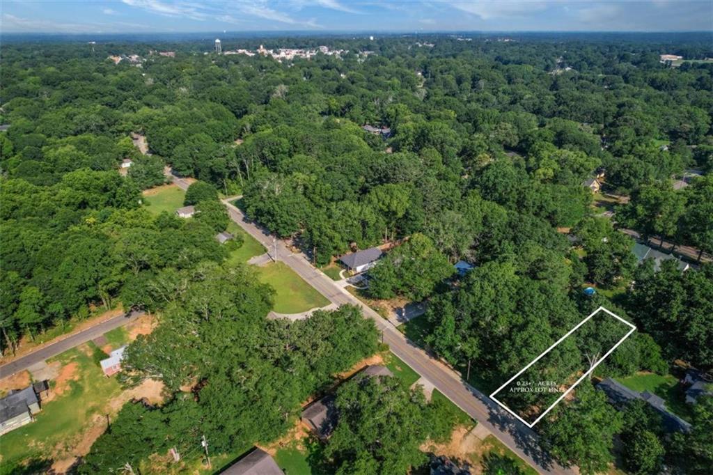 1015 H Davis St Street Monroe, GA 30655 - Photo 3 of 8 an aerial view of a house with a yard