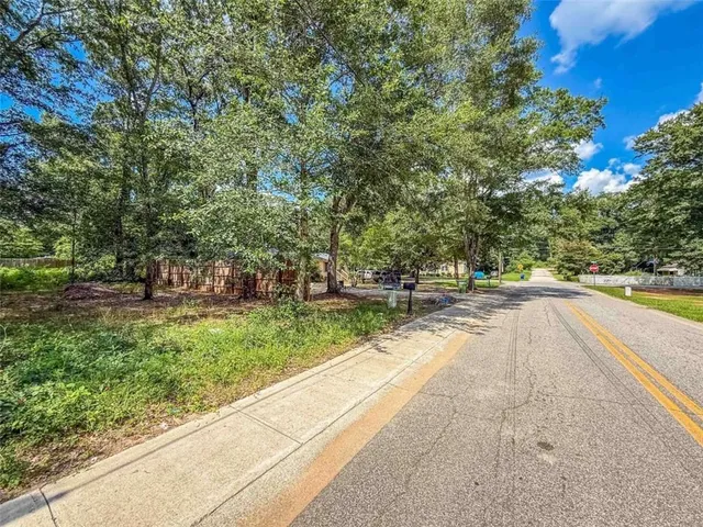 a view of swimming pool with trees