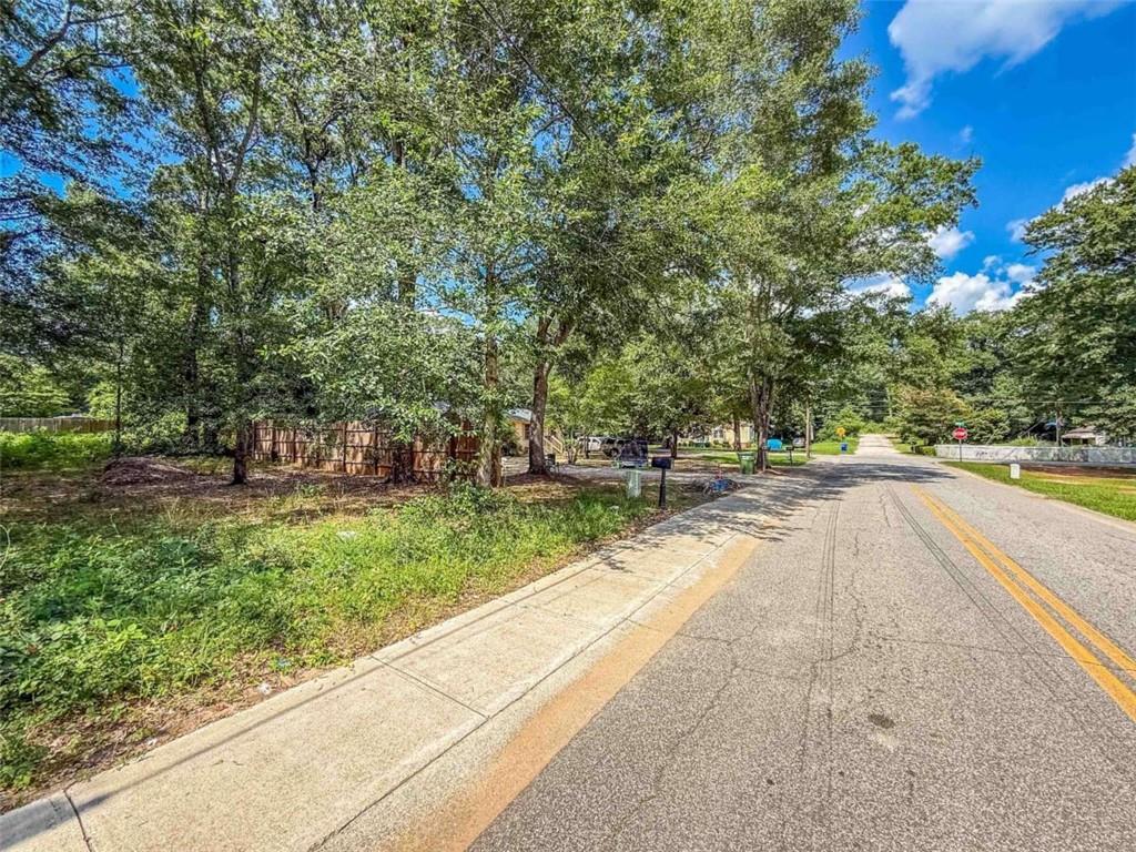 1015 H Davis St Street Monroe, GA 30655 - Photo 6 of 8 a view of swimming pool with trees