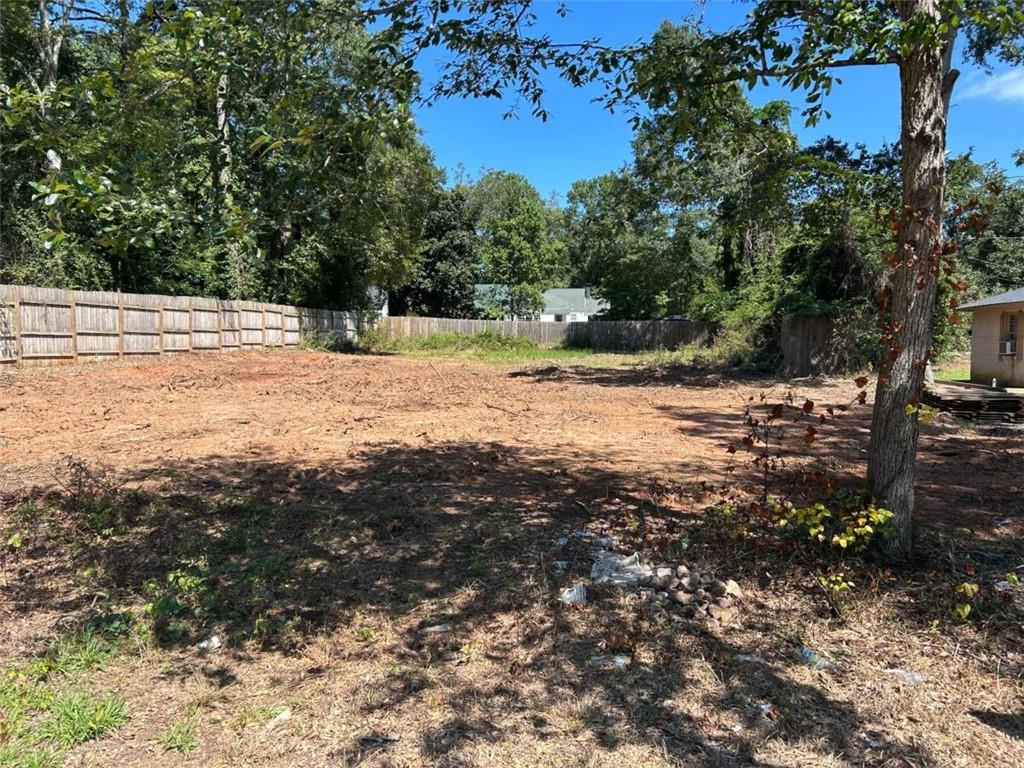 1015 H Davis St Street Monroe, GA 30655 - Photo 7 of 8 a view of a yard with trees
