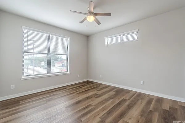 a view of room with window and ceiling fan
