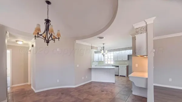 a view of a room with wooden floor and windows
