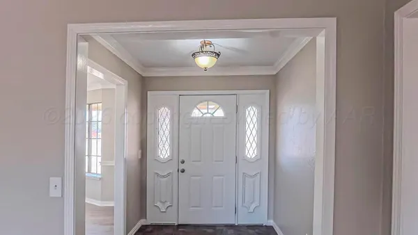 a view of front door with lamp