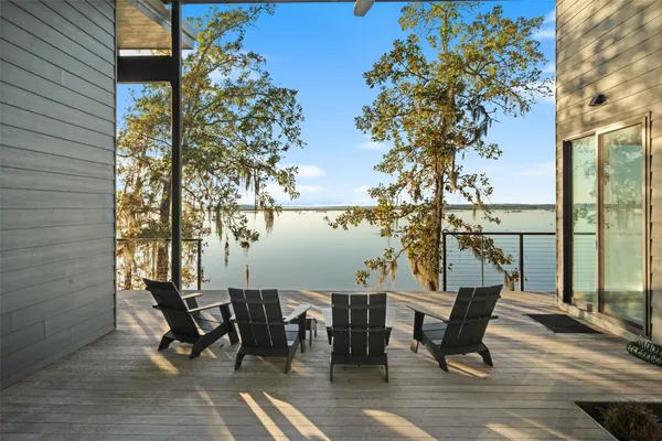 a view of a bathroom with wooden floor and a window