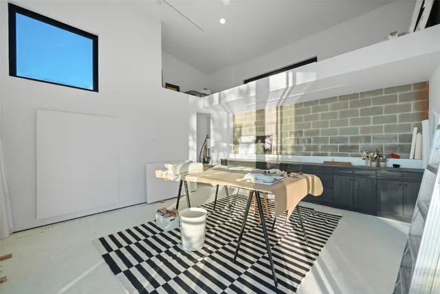 a dining room with furniture window and outside view